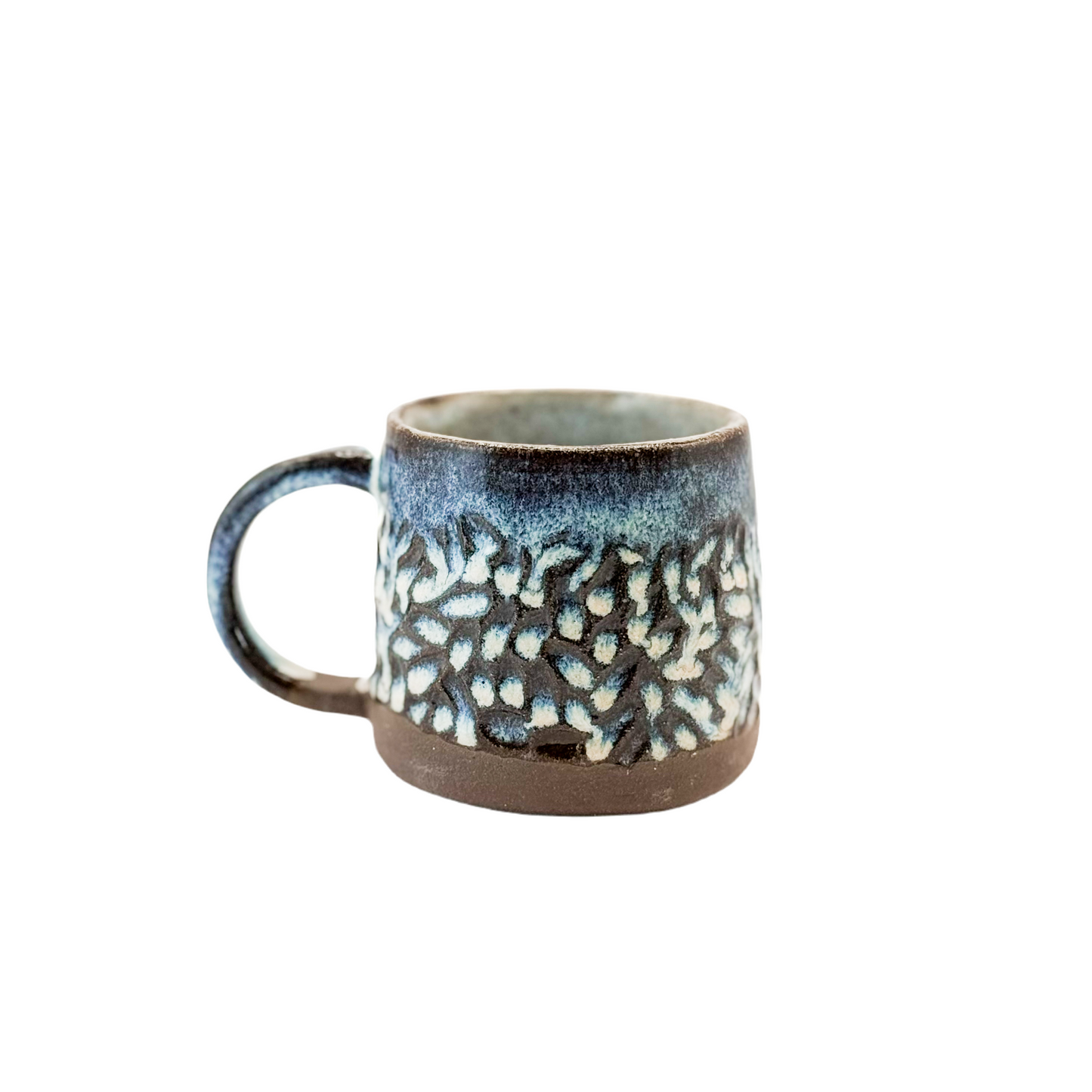 Carved Mug on Dark Clay